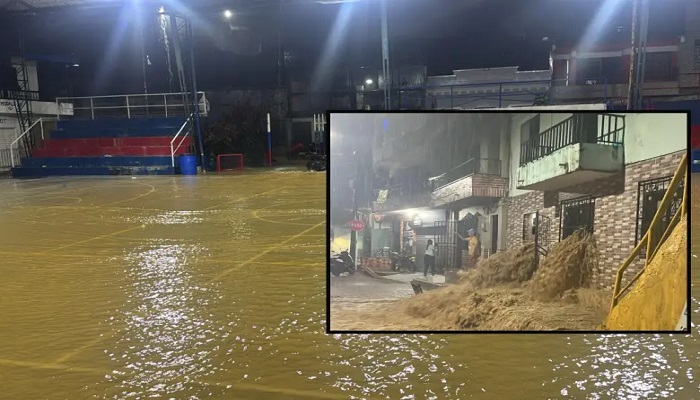 Adelante, una de las casas afectadas. Atrás, el colegio local inundado. FOTO: imagen tomada de redes.